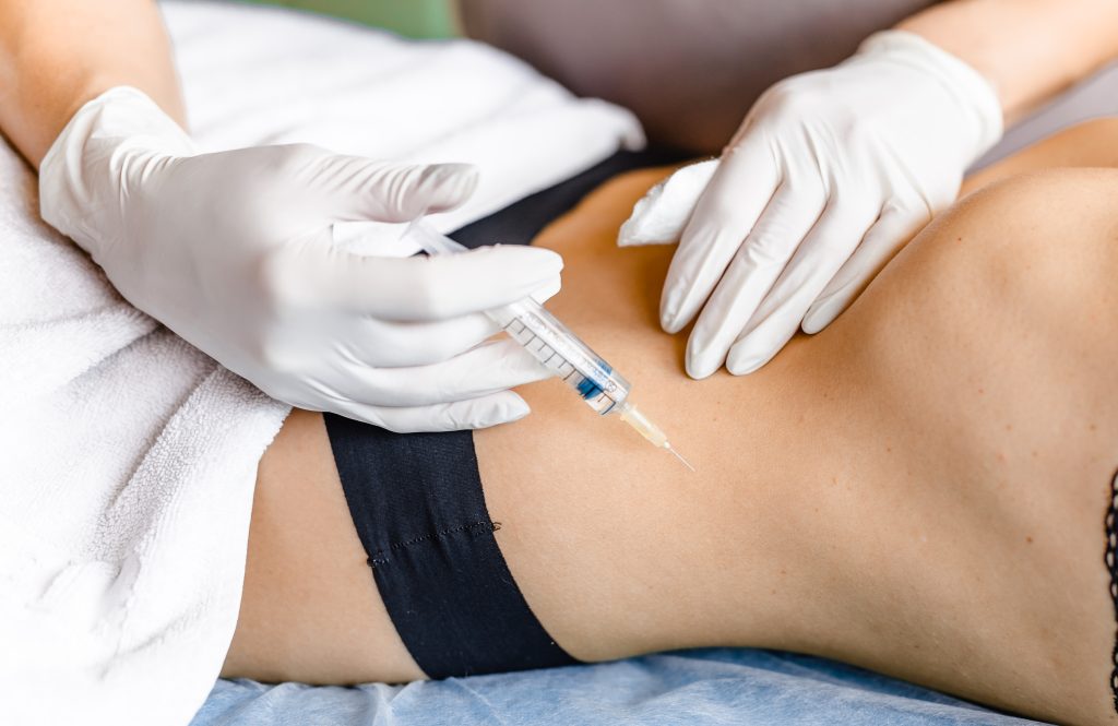 beauty shots in the stomach for recovery by a doctor at the clinic. the concept of self care